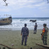 Dozens of weak Rohingya land on Indonesian beach after weeks at sea