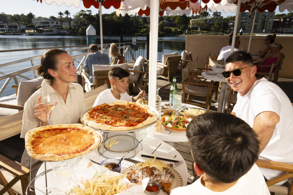 Travis and Chloe Young with their children, Jett, 10, and Ace, 7, at Pippi’s in Cronulla.