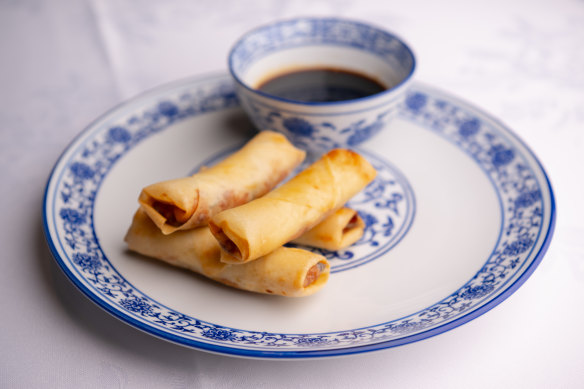 Lobster and scallop spring rolls with vinegar sauce.  