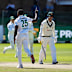 South Africa’s Kagiso Rabada, centre, celebrates the wicket of Australia’s Nic Maddinson, right, on day four.