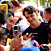 Oscar Piastri poses for a selfie with a fan at the 2026 Australian Grand Prix.