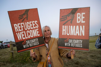 A woman protests against the Rwanda deportation flight at Boscombe Down Air Base in Wiltshire, England this week.