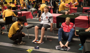 Toeing the line: Competitors solve Rubik's Cube with their feet at the Speedcubing World Championship in Melbourne.