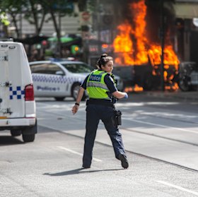 A police officer at the scene of the Bourke Street attack.