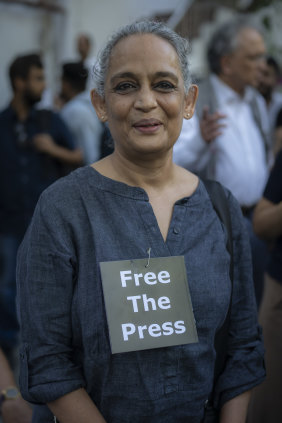 Roy protests in New Delhi on October 4 after police arrested  the editor of a news website critical of Prime Minister Narendra Modi and his government.