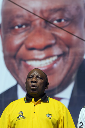 South African President Cyril Ramaphosa sings the national anthem at Sunday's rally.