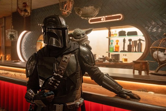 The Mandalorian (Pedro Pascal) and Grogu in a scene from the film.