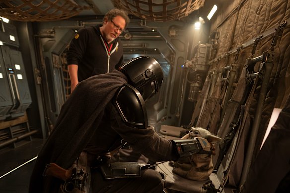 Jon Favreau on set with Pedro Pascal.