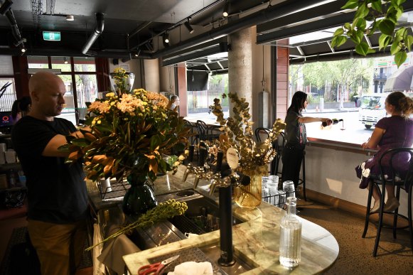 Catarina Isola pours a glass of wine at her café and restaurant, The Wedge, on Glebe Point Road.