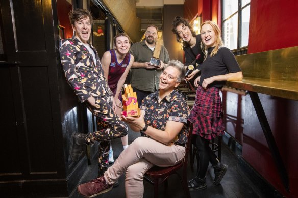 Geraldine Hickey (middle) with her 2021 Melbourne International Comedy Festival Award, with fellow winners (from left) Charlie Zangle, 
Melanie Bracewell, Greg Larsen, Nat Harris and Hannah Camilleri. 