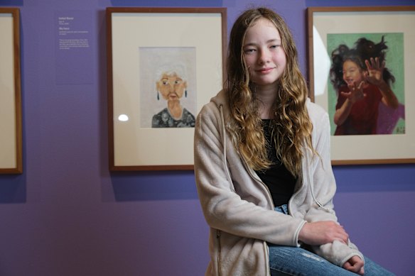 Isobel Bazar, aged 11, with her portrait of her Oma.