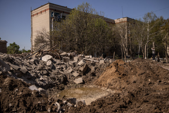 A large missile crater in front of a residential apartment block damaged one day before by a Russian missile strike on May 06, 2022 in Kramatorsk, Ukraine.