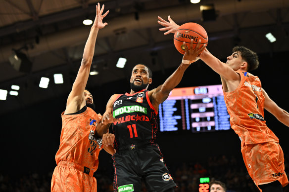 Bryce Cotton of the Wildcats goes to the basket against Cairns.