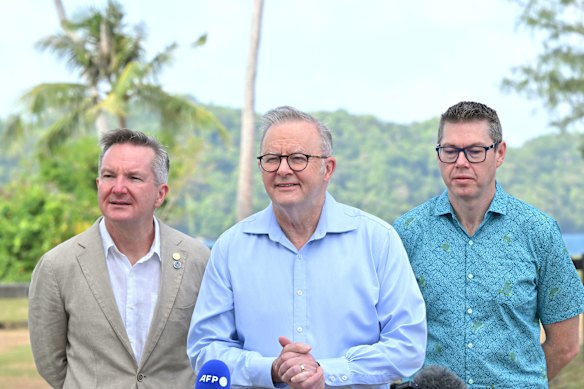 Climate Change Minister Chris Bowen, left, standing alongside Prime Minister Anthony Albanese and Pacific Island Affairs Minister Pat Conroy earlier this week in Palau.