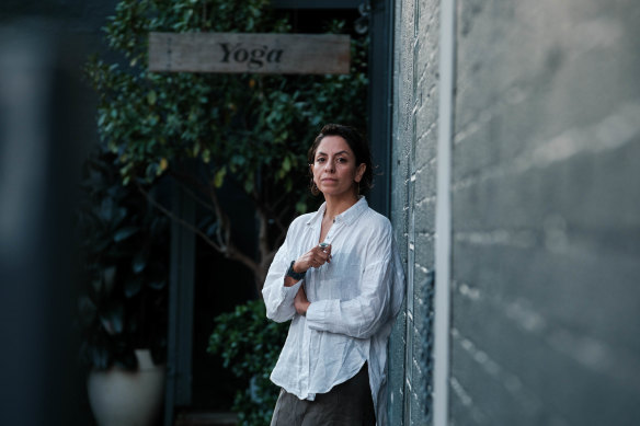 Yoga instructor Jacqueline Lastra outside Egg of the Universe, which she says owes her $9000.