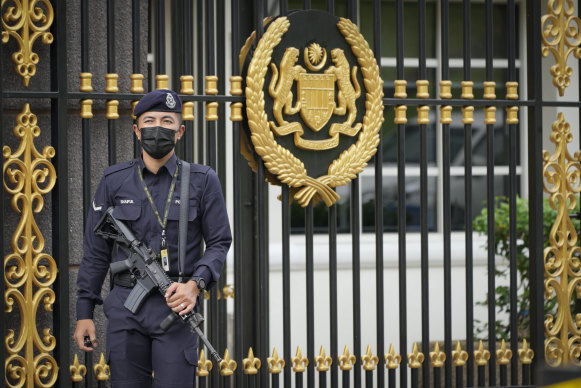 Armed National palace police stands guard at the National Palace in Kuala Lumpur, Malaysia, on Wednesday.