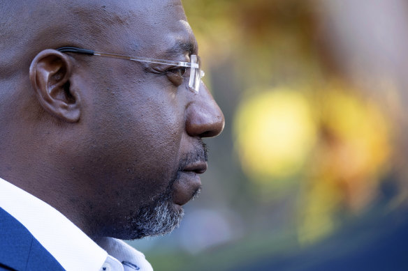 US Senator Raphael Warnock after voting on the first day of early voting in Atlanta on Monday,