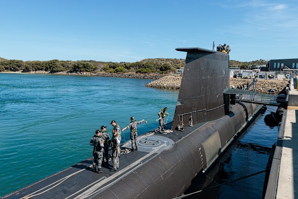 Crew members working on board HMAS Rankin, a Collins-class submarine, at HMAS Stirling in Western Australia.