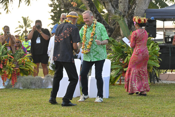 Australia’s Prime Minister Anthony Albanese dances before receiving a gift during a welcome ceremony the Pacific Island Forum (PIF) in Aitutaki, Cook Islands,.