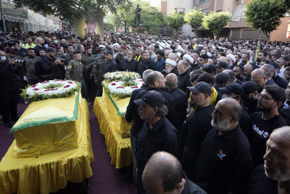 Hezbollah’s deputy leader Naim Kassem, centre, speaks during the funeral of Hezbollah commander Ibrahim Akil and militant Mahmoud Hamad.