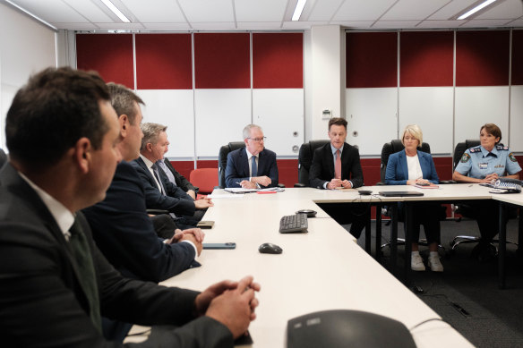 NSW Premier Chris Minns (third from right) with other MPs and community leaders at Fairfield police station on Tuesday.