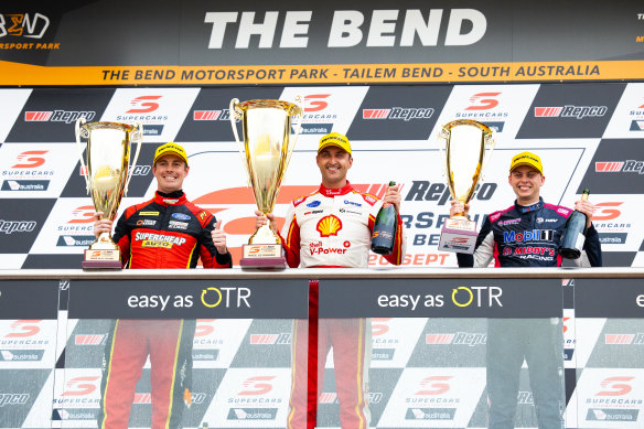 Winner Fabian Coulthard, centre, on the podium with runner-up Jack Le Brocq,  left, and Bryce Fullwood, right, who was third. 