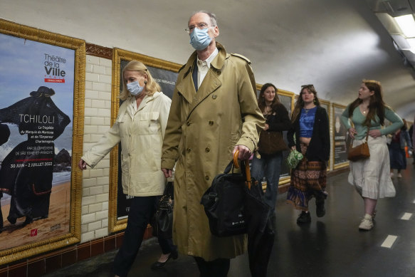 People wearing face masks to protect against COVID-19 on a platform at the Paris Metro. Virus cases are rising fast in France and other European countries after COVID-19 restrictions were lifted in the spring. 