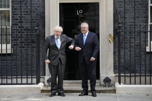 Britain’s Prime Minister Boris Johnson greets Australia’s Prime Minister Scott Morrison.