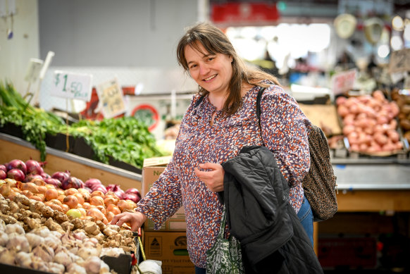 Shopper Jacqui Byard sifting through vegetables at Melbourne’s Queen Victoria Market on Thursday.