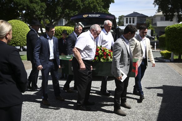 Pallbearers including Bob McCarthy, Ron Coote and family members at John Sattler’s funeral.