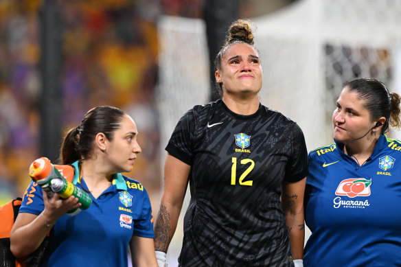 Brazilian goalkeeper Natascha is helped from the pitch.