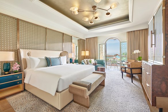 A hotel suite and its king-size bed.
