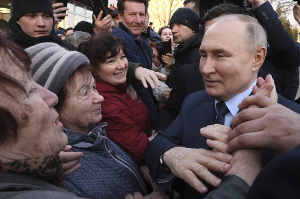Russian President Vladimir Putin meets with residents following a visit to the Solnechniy Dar greenhouse complex outside Stavropol, Russia, on March 5. He has no opposition at this weekend’s elections.