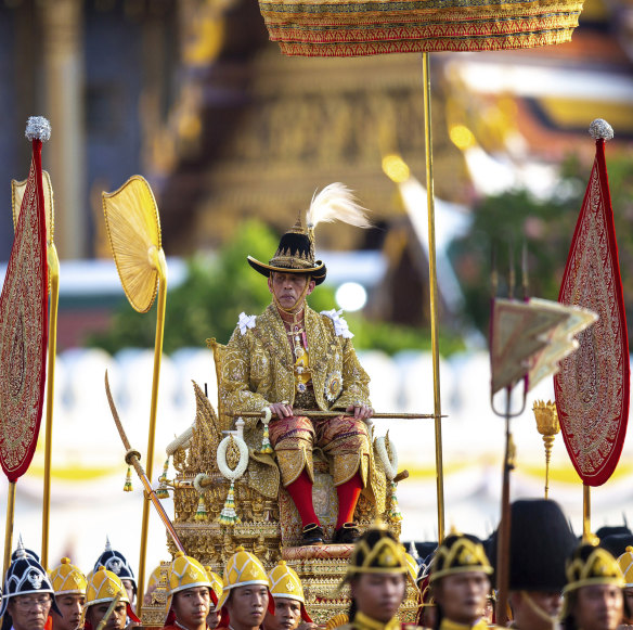Thailand's King Rama X is carried through the streets of Bangkok during the second day of his coronation ceremony in 2019. 