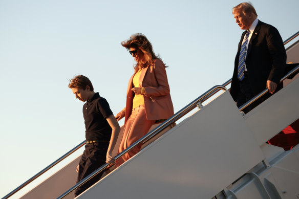 The US President, first lady Melania Trump and their son Barron Trump arrive on Air Force One at Palm Beach International Airport.