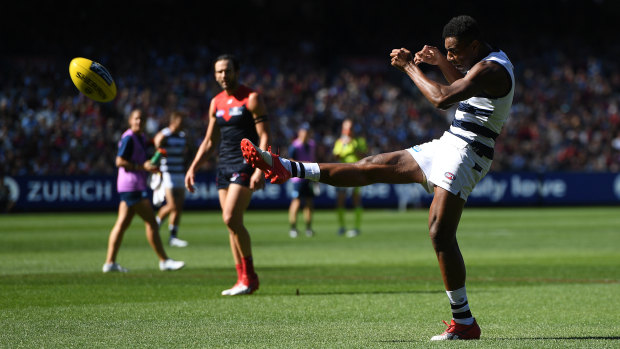 Dream debut: Esava Ratugolea kicks a goal with his first touch in his first AFL match for Geelong.