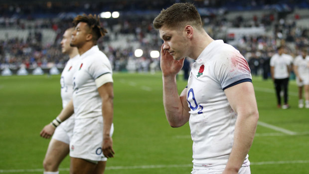 Tough times: Owen Farrell walks off the field after England's loss to France.