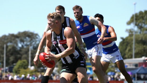 Collingwood's Adam Treloar breaks away during the Magpies clash with the Western Bulldogs at Moe.
