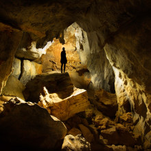 Person standing in Bauhinia Cave in Chillagoe