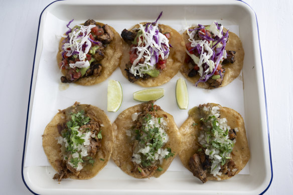 Chicken adobo tacos (top) and signature pork carnitas tacos (bottom) at Mami’s Casa Latino.