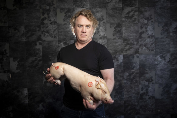 Chef Adrian Richardson with his suckling pig. He will no longer be able to get these suckling pigs.
