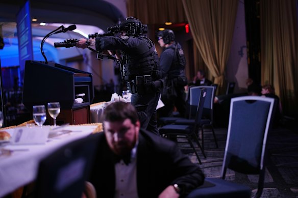 Agents stand guard after a shooter opened fire outside the ballroom.