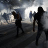 Paris police fire tear gas, arrest 163 people as trio of protests turns violent