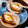 Khachapuri Adjarian style, with cheese and egg. 