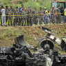 At least 18 dead as plane skids off runway and catches fire in Nepal