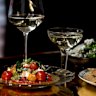 The menu includes tomatoes with truffle mayo, and tarragon-forward chicken dip with tortilla chips. 