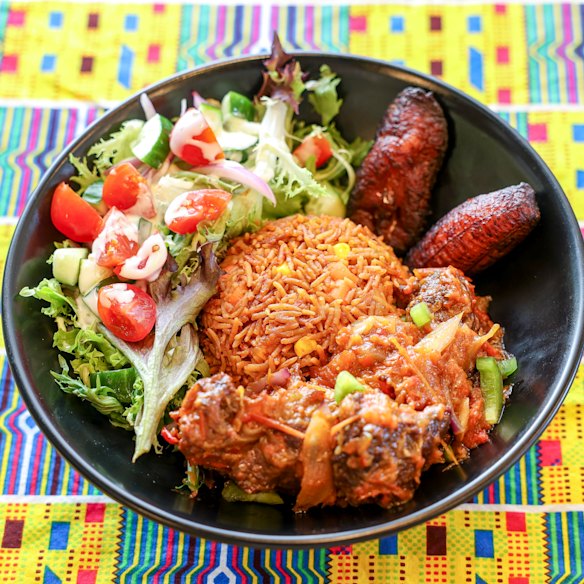 Jollof Vibe’s Liberian jollof rice, beef, fried plantains and a dressed salad.