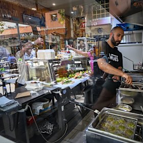 Preparing food in the Half Moon Cafe in Coburg.