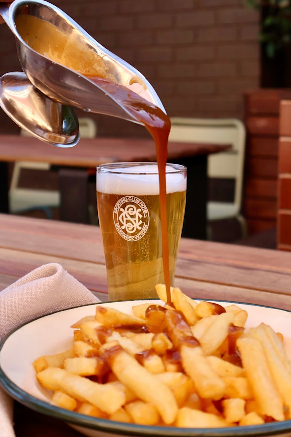 Chips with gravy at Brunswick’s Sporting Club Hotel.