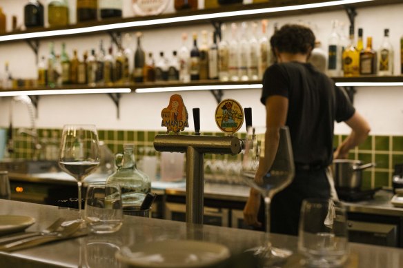 House-made mezcal infusions behind the bar at Maiz.